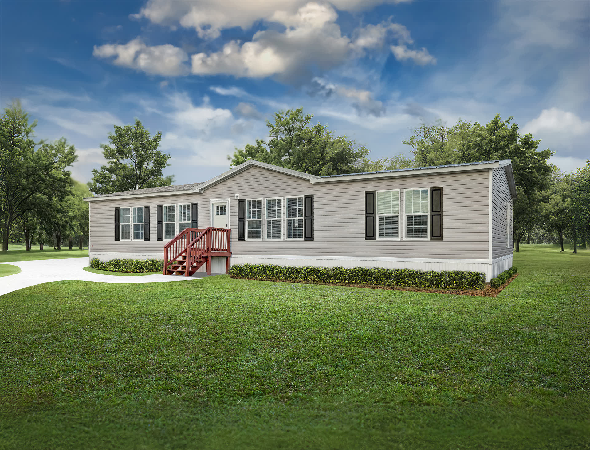 The exterior of a new manufactured home set on its lot.