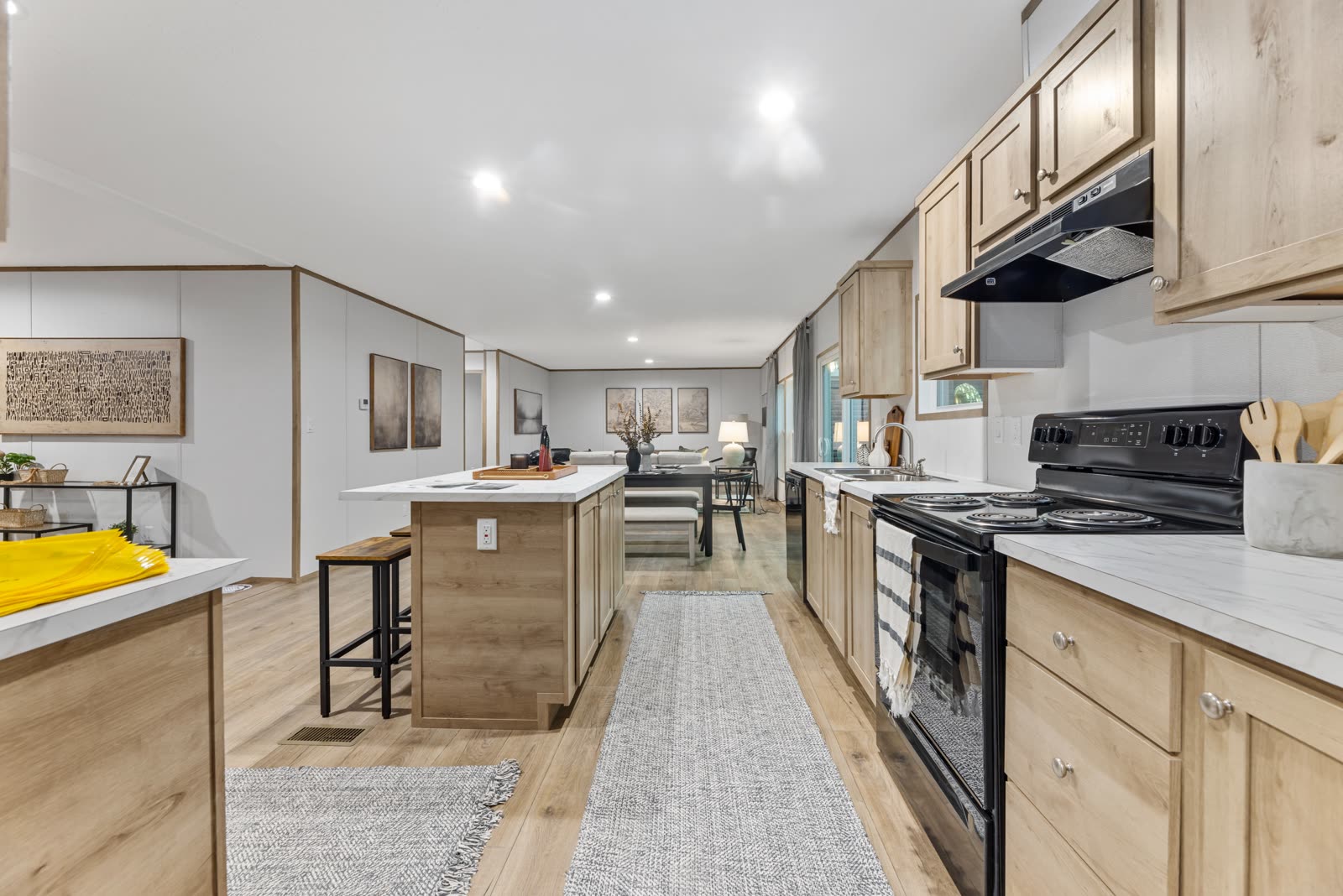 Kitchen galley. Range, island, runner to the living room.