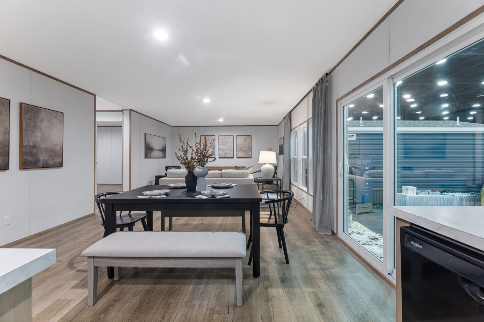 Dining. Table and bench beside the sliding glass door.