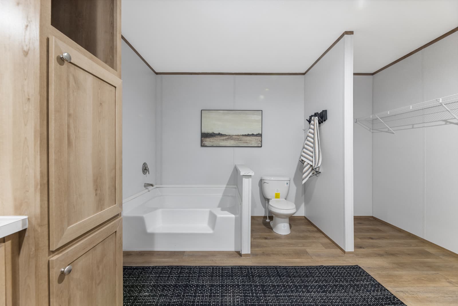 Bath 1. Linen cabinet and tub.