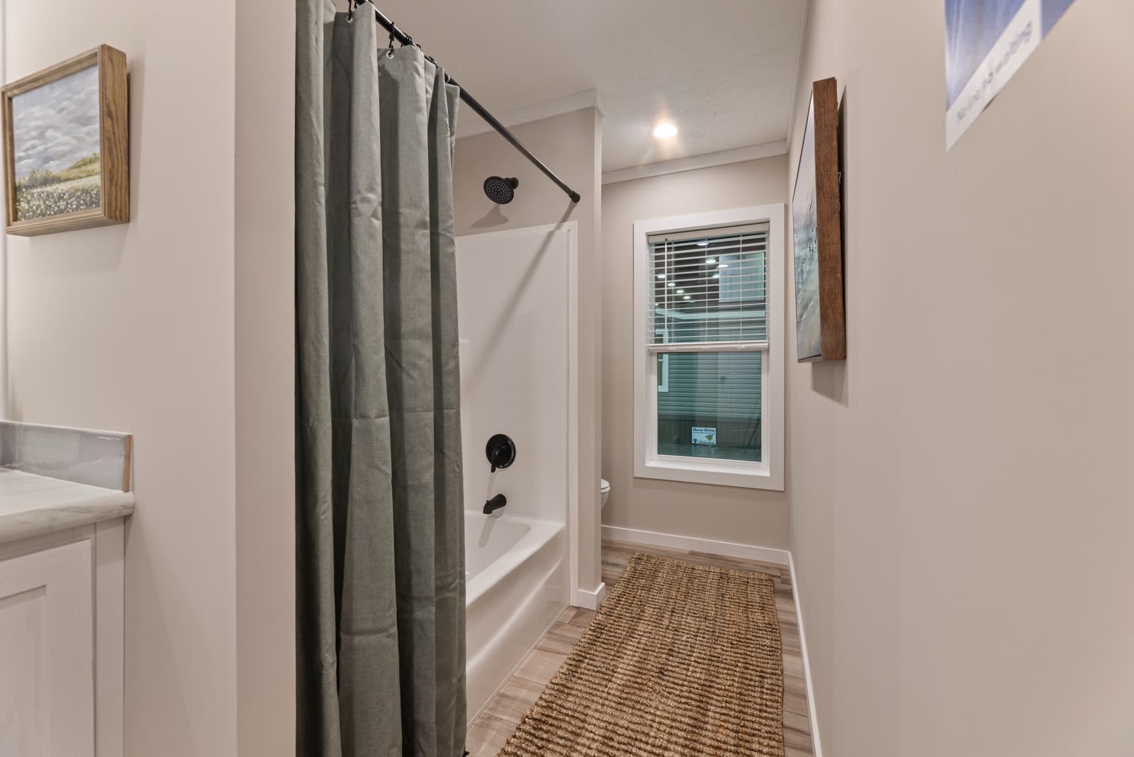 Bath 2. Tub with shower curtain, window.