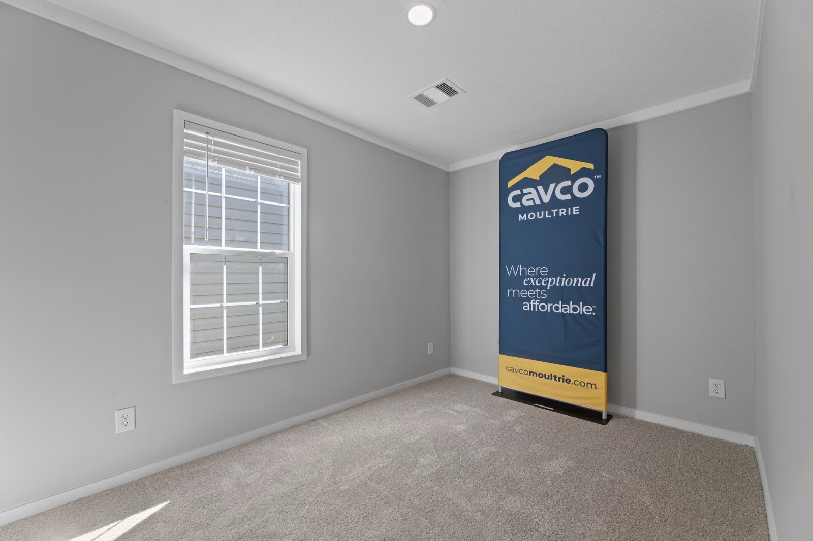 Bedroom 3. Empty, carpet, window. Builder banner in the corner.