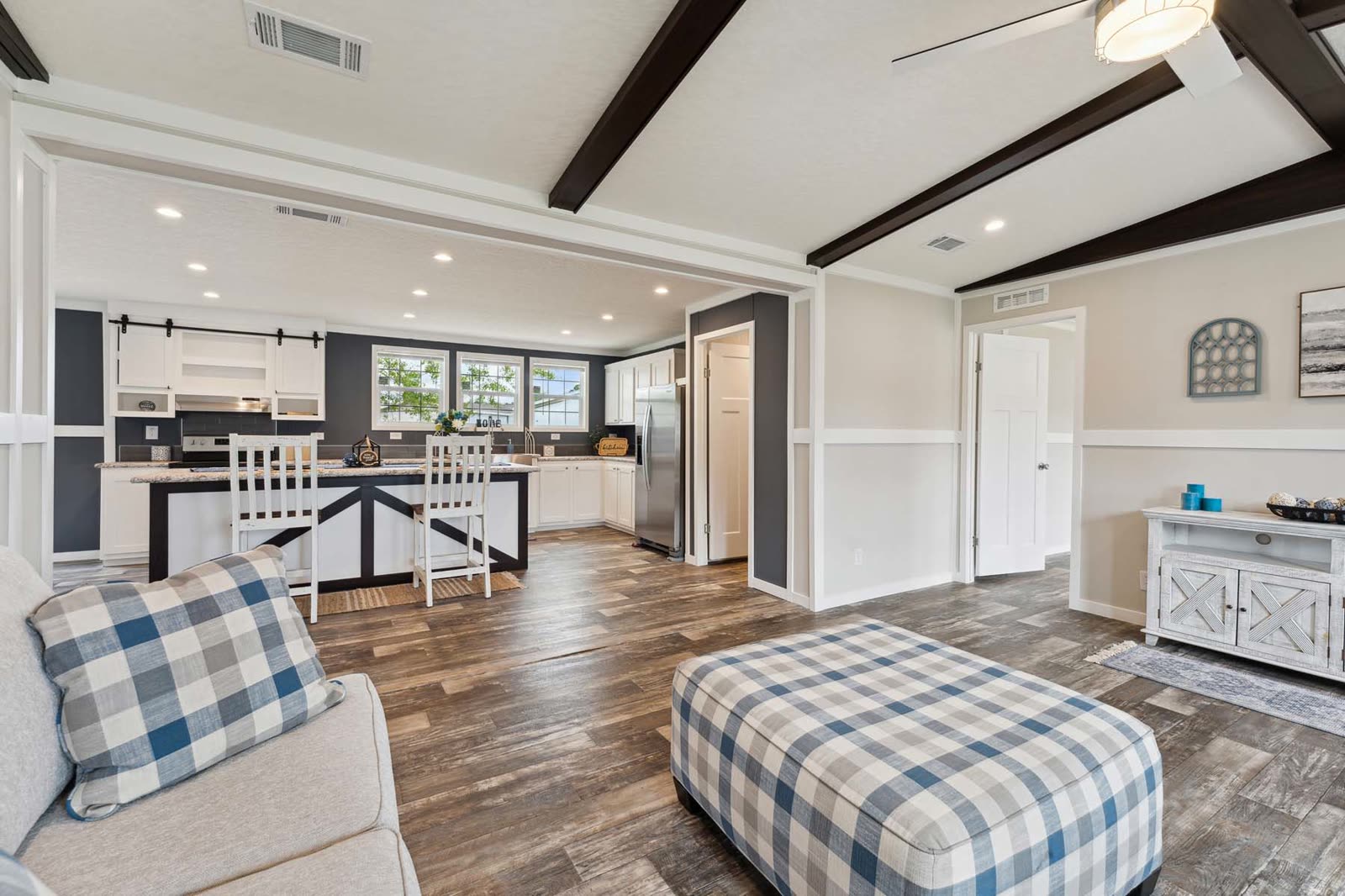 Living room, first furnishing. Kitchen island and dining beyond, console table.