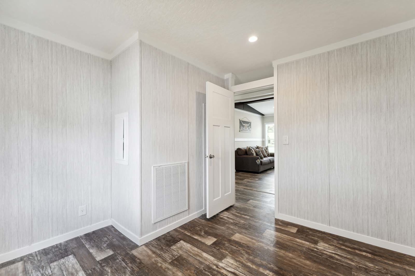 Bedroom. Empty, door open to the family room.