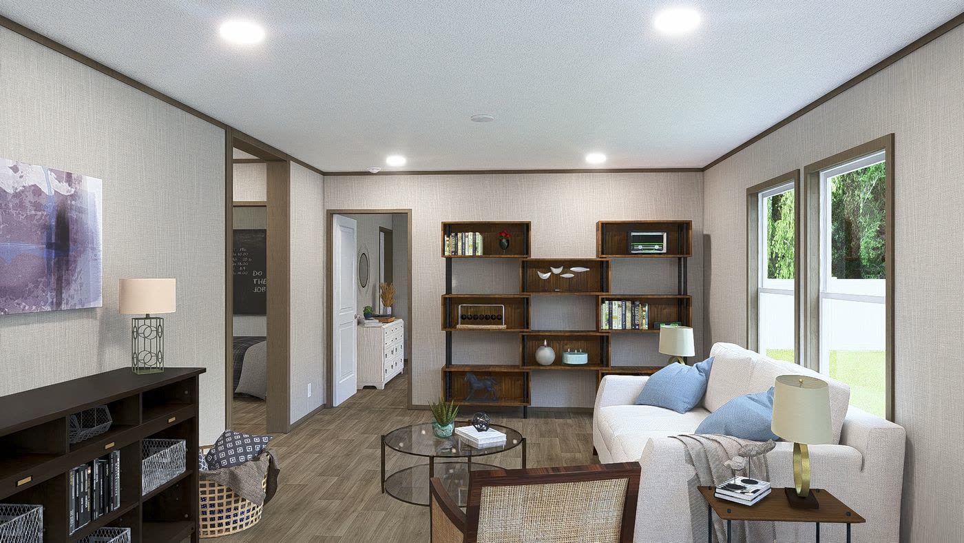 Family room. Open bookshelf, white sofa, bedroom hall to the left.