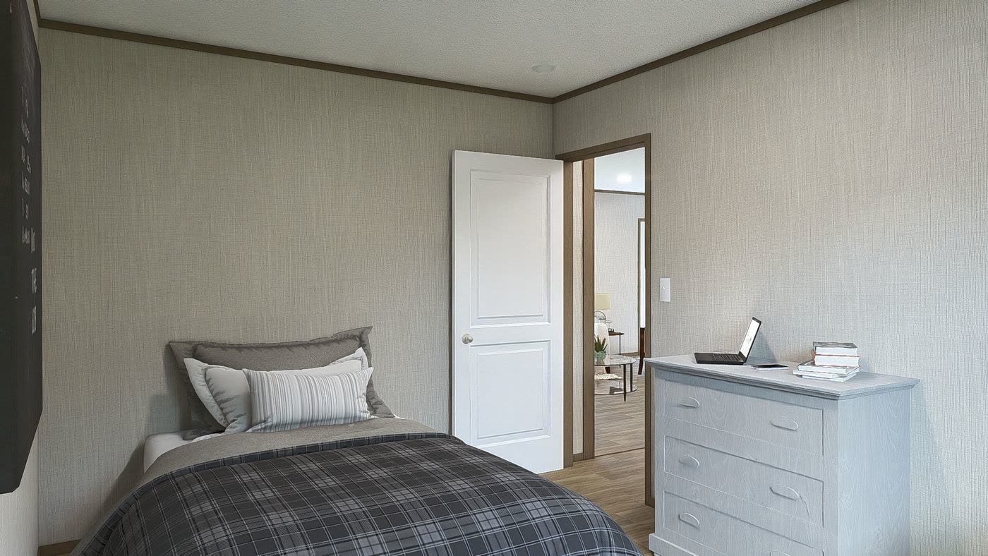 Guest bedroom. Bed with plaid cover, dresser, doors to the hall.