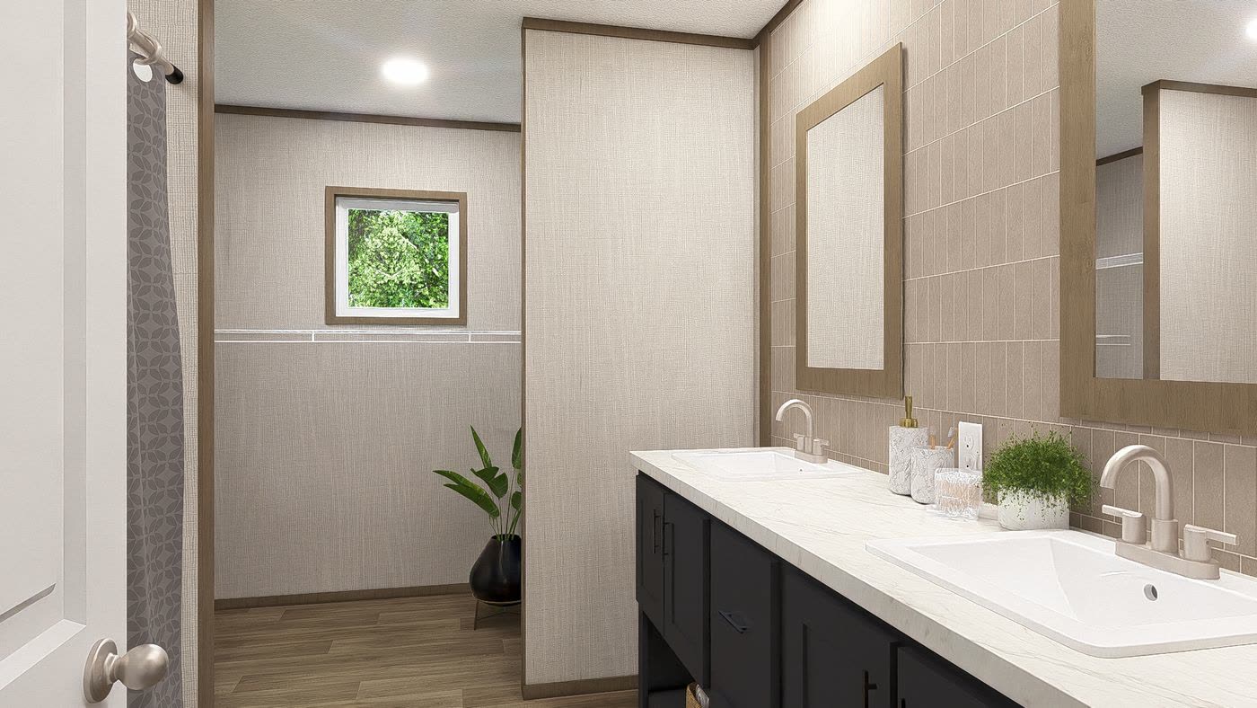 Primary bath, Tranquility finish. Double sinks on a dark vanity, two mirrors, small window.