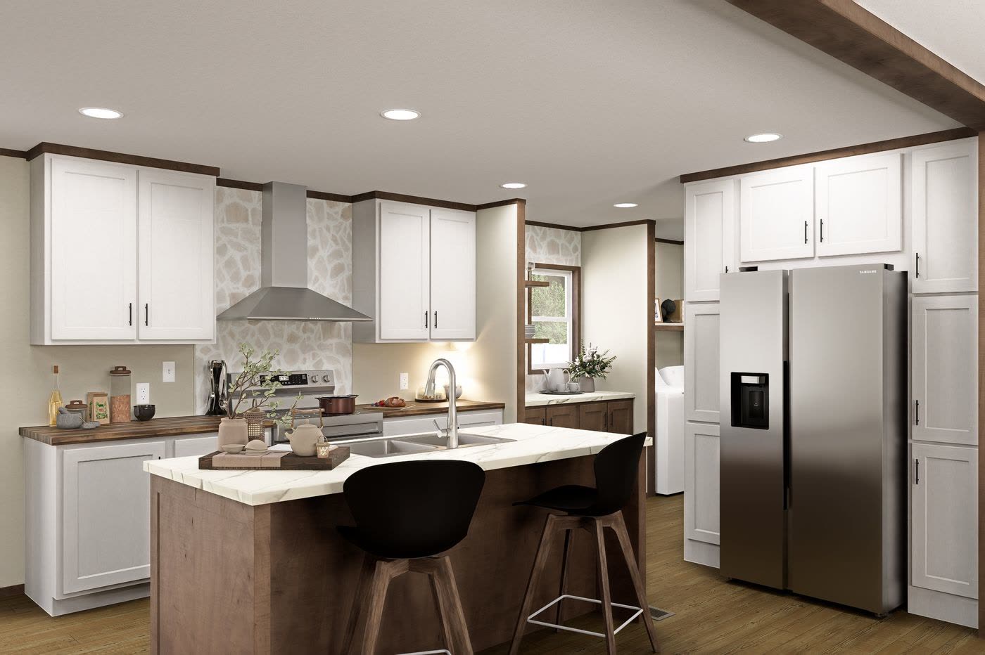 Kitchen. White cabinets, wood island with two stools, stainless refrigerator and range hood.