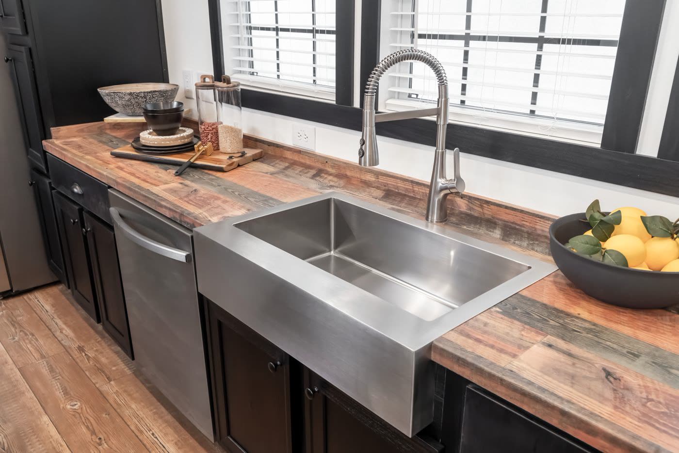 Kitchen. Farmhouse sink with pull-down faucet, window, dishwasher.